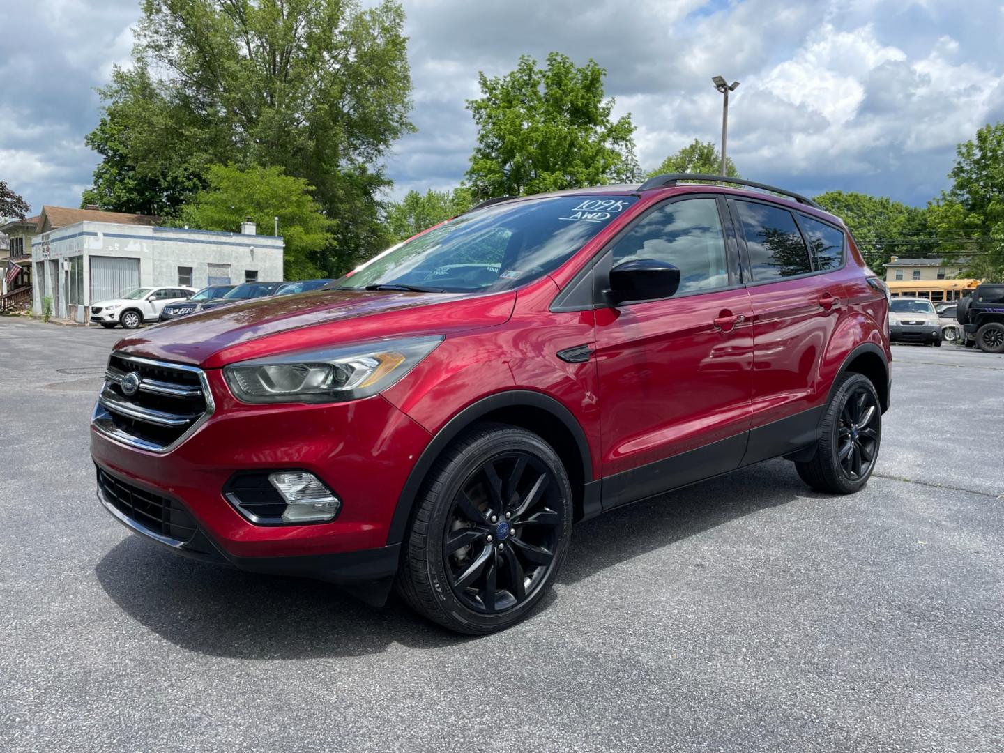 2017 Red Ford Escape SE 4WD (1FMCU9GDXHU) with an 1.5L L4 DOHC 16V engine, 6A transmission, located at 101 N. Main Street, Muncy, PA, 17756, (570) 546-5462, 41.207691, -76.785942 - Photo#0